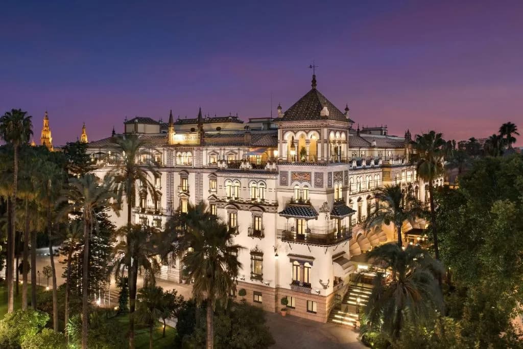 Hotel Alfonso XIII in Seville illuminated at dusk