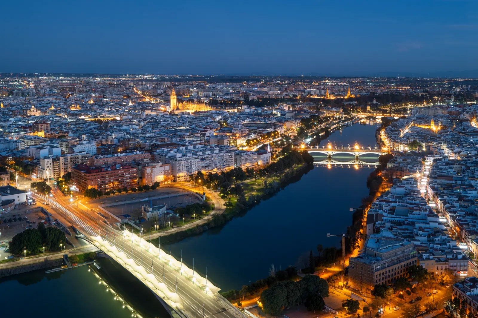 Aerial view of Seville and the Guadalquivir River at night