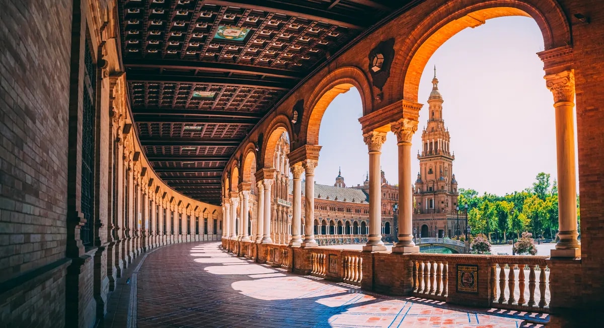 Plaza de España in Seville with tiled arches and canal
