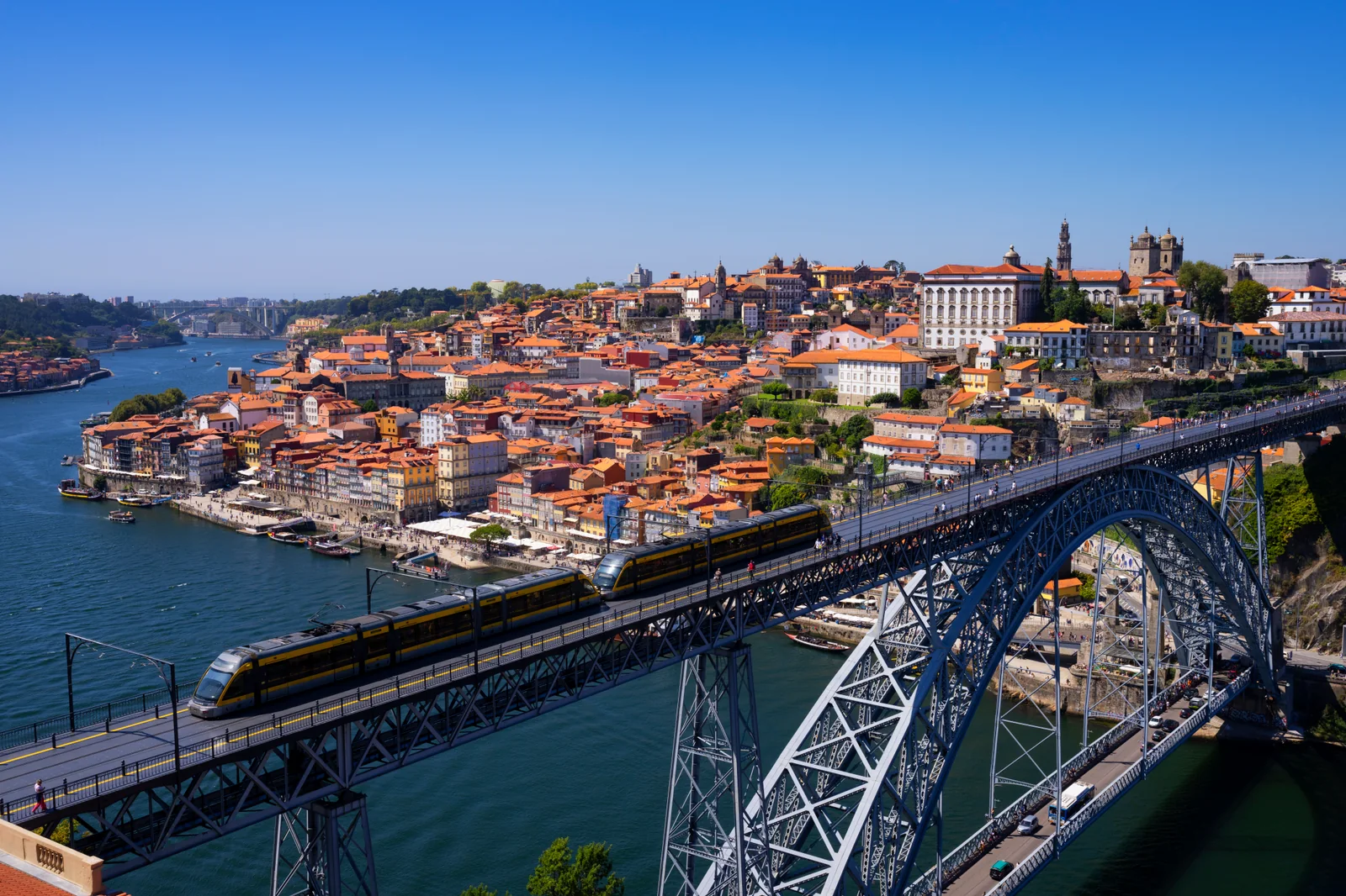 Dom Luís I Bridge crossing the Douro River, with Porto's historic waterfront in the background