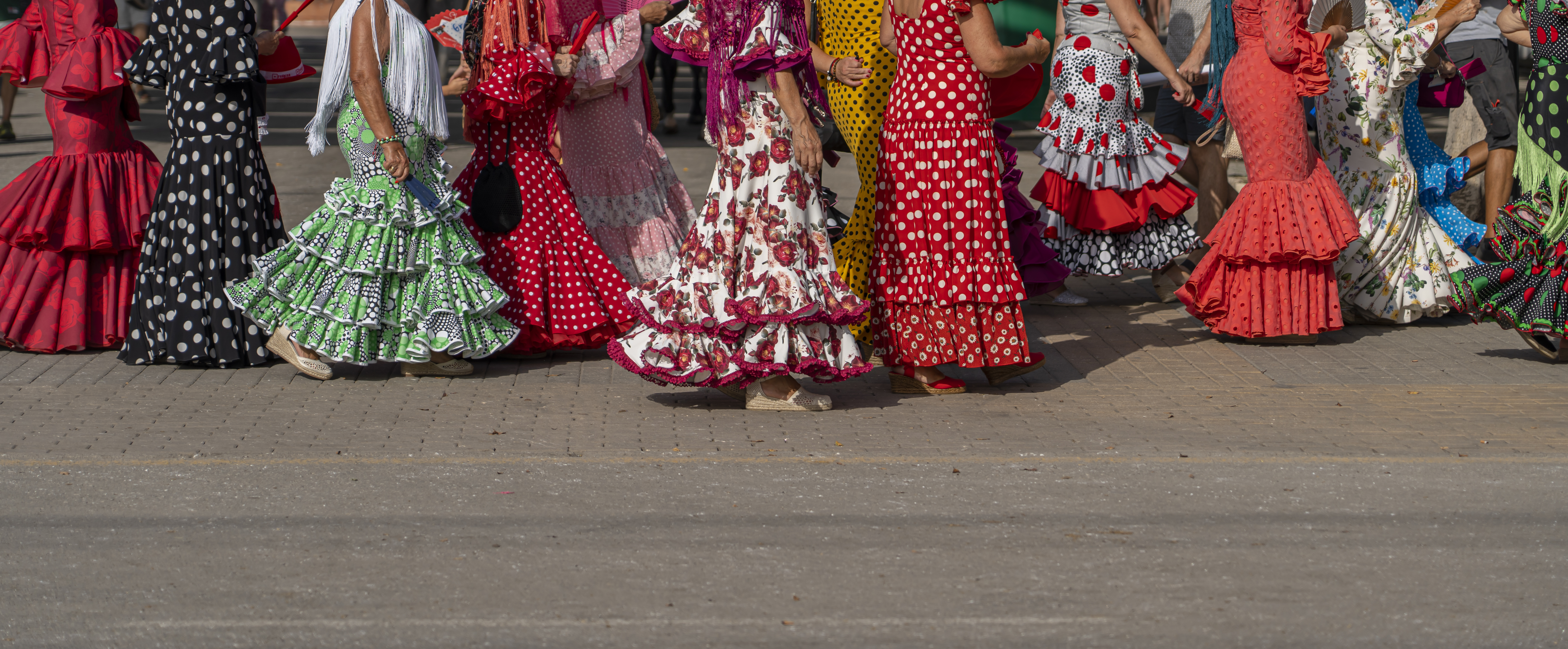 Colorful flamenco dresses during Feria de Abril in Seville