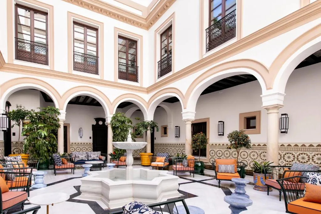 Hotel Casa Palacio Don Ramón Seville courtyard with arches and fountain