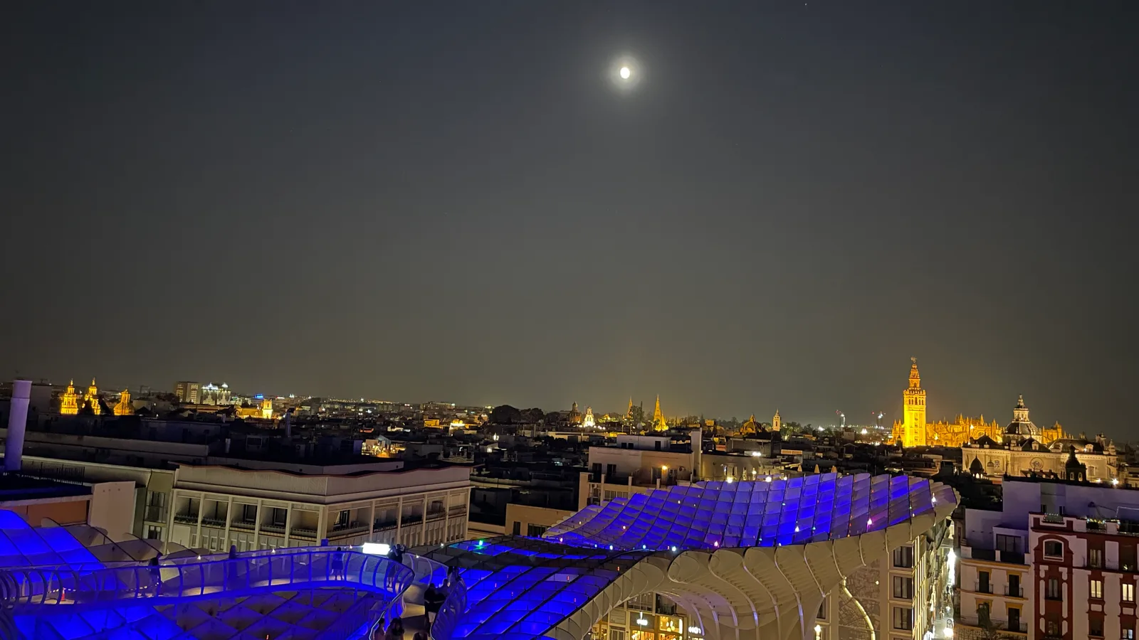 Setas de Sevilla Aurora night view over Seville with the Giralda illuminated